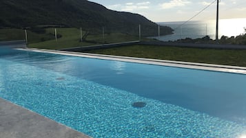 Seasonal outdoor pool, pool umbrellas, pool loungers