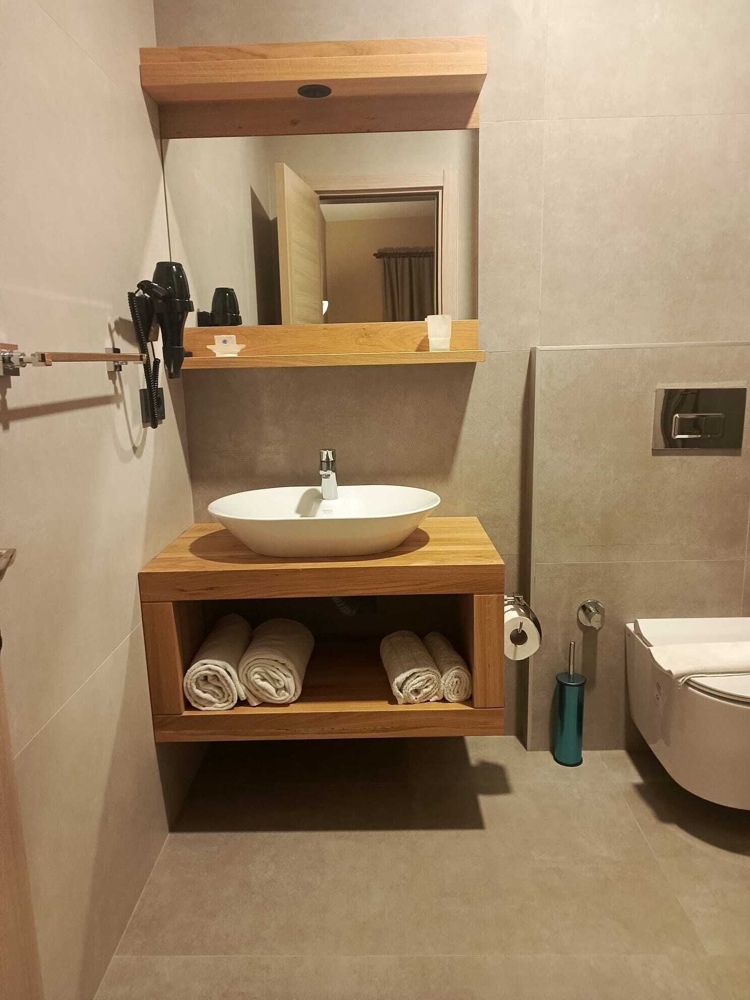 Shower, hair dryer, slippers, towels