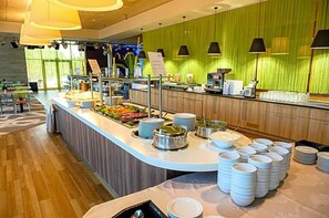 A buffet setup with various food items and serving utensils. - Sanatorium & Spa Toila (Toila)
