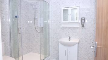 Shower, towels, toilet paper