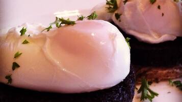 A plate with two poached eggs on toast, garnished with parsley.