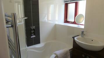 Combined shower/tub, hair dryer, towels, toilet paper