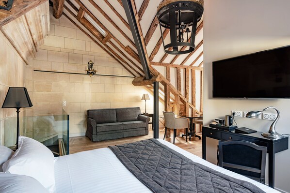 Suite Signature, plusieurs lits | Literie de qualité supérieure, minibar, coffres-forts dans les chambres