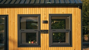 A wooden building with two windows and a door. - Yol Glamping Hotel Retreat Center (Fethiye)