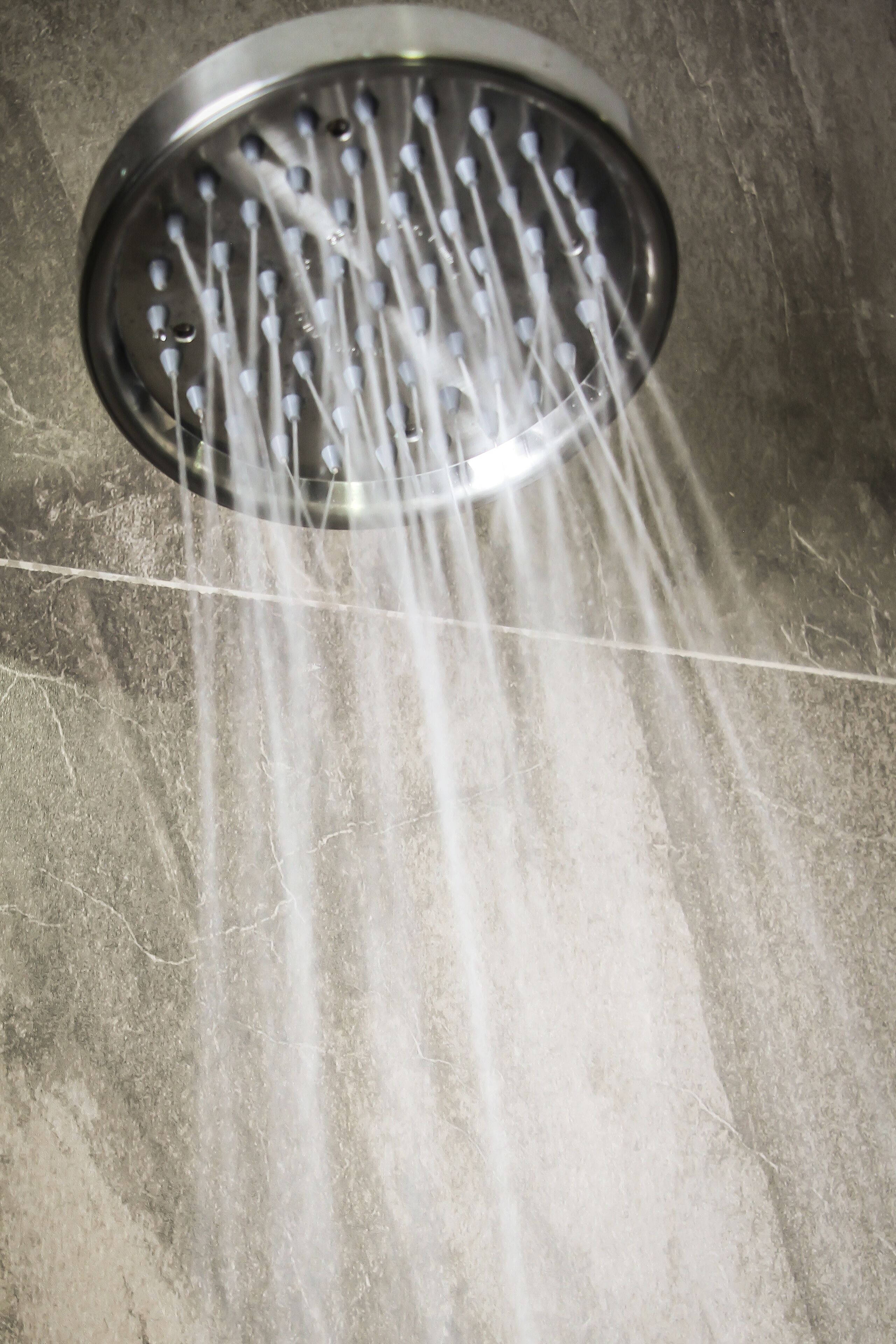 studio suite | bathroom | shower, rainfall showerhead, hair dryer, towels