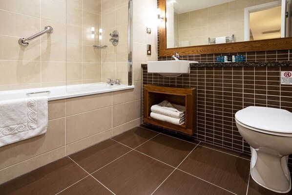 A bathroom with a bathtub, a sink, and a toilet. - Castle Green Hotel In Kendal, BW Premier Collection (Kendal)