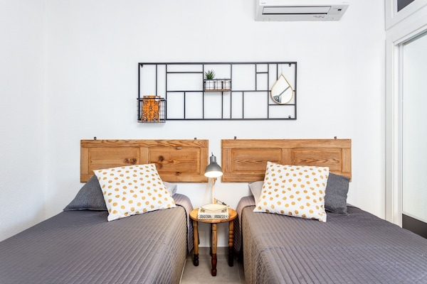 Second bedroom with two single beds and private balcony