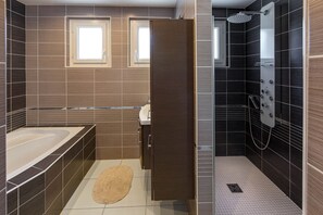 Bathtub, hair dryer, towels, soap