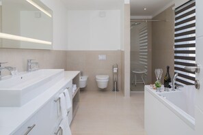 A modern bathroom with a large sink, toilet, and shower area. - Luxury Villa Nautica Seconda with Pool (Seget Donji)