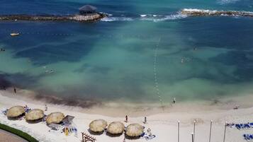 On the beach, sun-loungers, beach towels