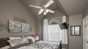 A bedroom with a bed, ceiling fan, artwork, and a window with blinds. - 4 Bedroom With Landscaped Private Pool & Outdoor Pool Table ~MONTHLY DISCOUNT~ (McKinney)