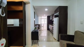 Apartamento superior, 1 cama de casal | Área de estar | Smart TV