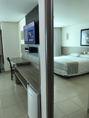 Classic Triple Room | Minibar, in-room safe, individually decorated, desk
