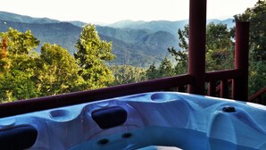 A hot tub with a view of mountains and trees. - Mtn Views/Large Master Suite/Hot Tub/Wi-Fi (Bryson City)