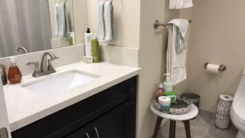 Combined shower/tub, hair dryer, towels, soap