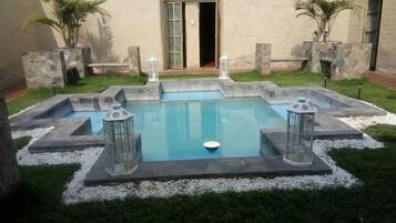 2 outdoor pools, pool umbrellas, pool loungers