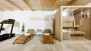 A wellness center with wooden benches, a treadmill, and a glass-enclosed sauna. - Gorgeous home in Radosinovci with sauna (Radosinovci)