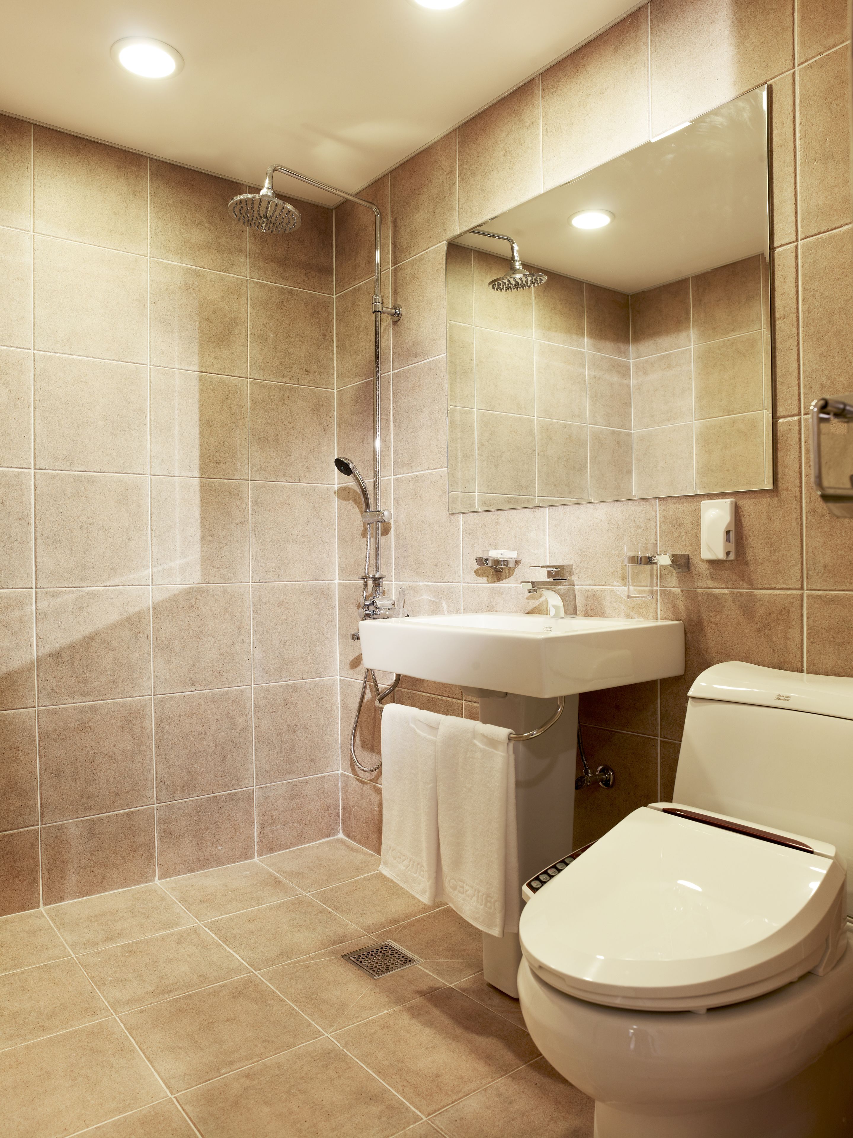 shower, hair dryer, slippers, towels