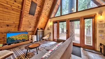 Télévision, cheminée, lecteur de DVD, chaßne hi-fi