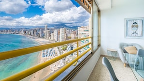 A balcony with a view of a beach and cityscape. - Don Miguel 1 18-A (Benidorm)