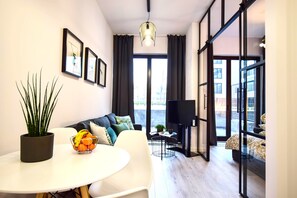 City-Apartment | Wohnbereich | Flachbildfernseher