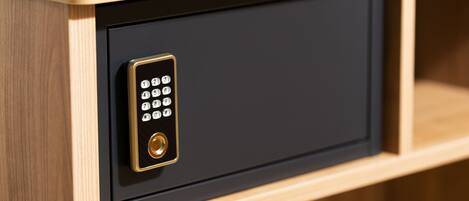 A wooden cabinet with a black electronic keypad lock.