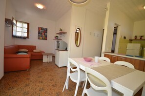 Standard Apartment, 3 Bedrooms, Terrace | Living area | TV - Borgo Veneziano (Lignano Sabbiadoro)