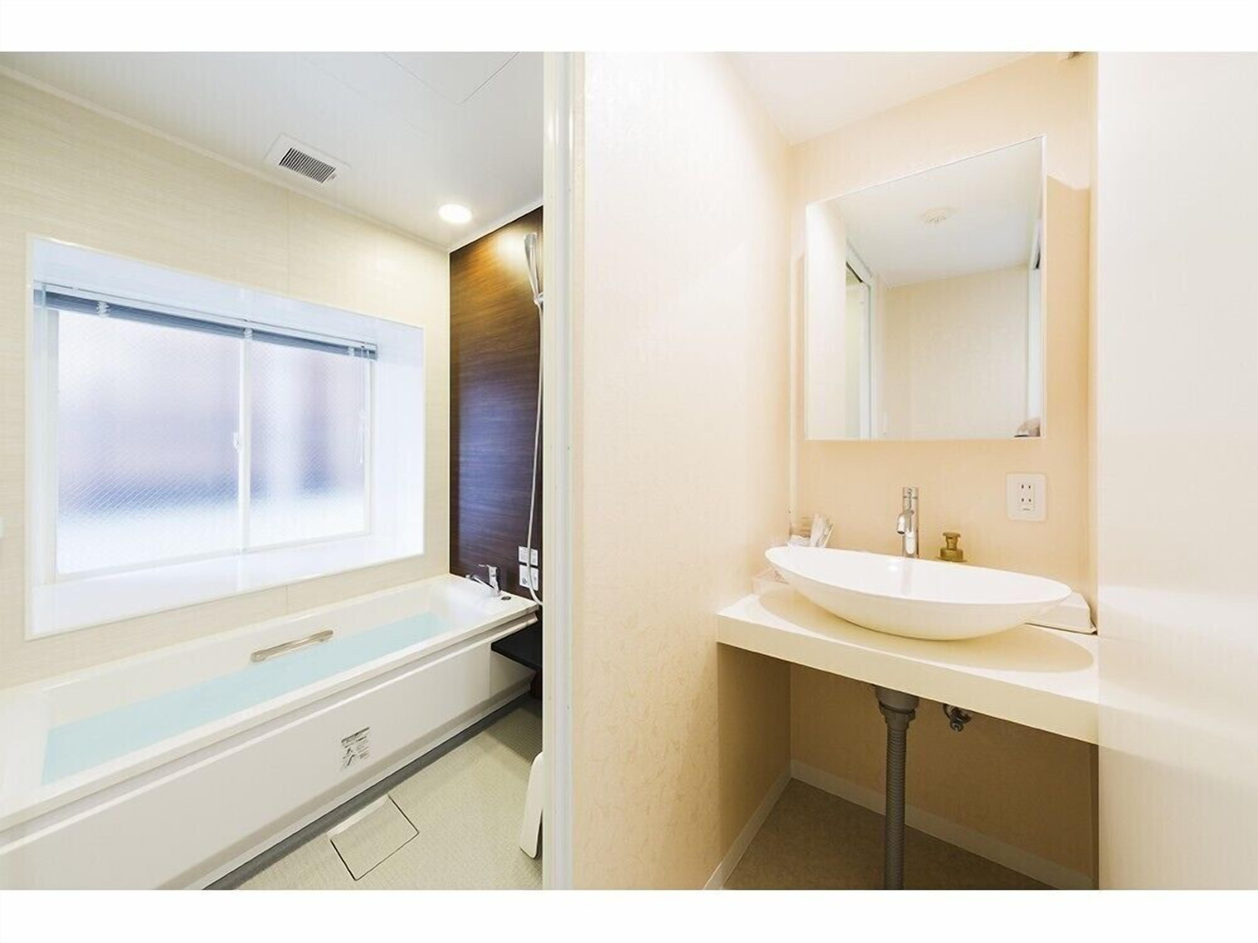 double room, ocean view | bathroom | separate bathtub and shower, deep-soaking bathtub, free toiletries