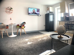 Comfort Apartment, 1 Queen Bed with Sofa bed, Patio | Living area | 38-inch LCD TV with premium channels, TV