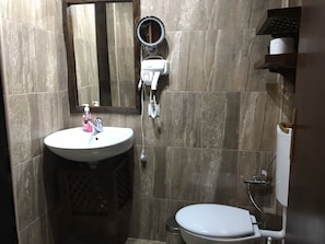 Shower, free toiletries, slippers, towels