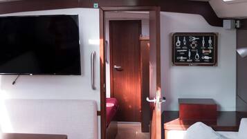50-inch flat-screen TV with digital channels, first-run films, pay films