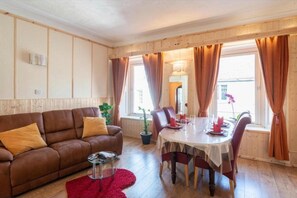Apartment | Living room | 30-inch TV with digital channels