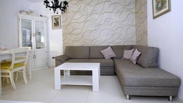 Villa, Pool Access | Living area | Flat-screen TV