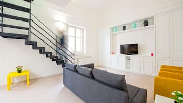 Duplex | Living area | 30-inch TV with satellite channels