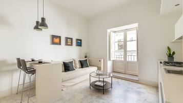 Apartment, 1 Bedroom | Living area | 30-inch TV with digital channels