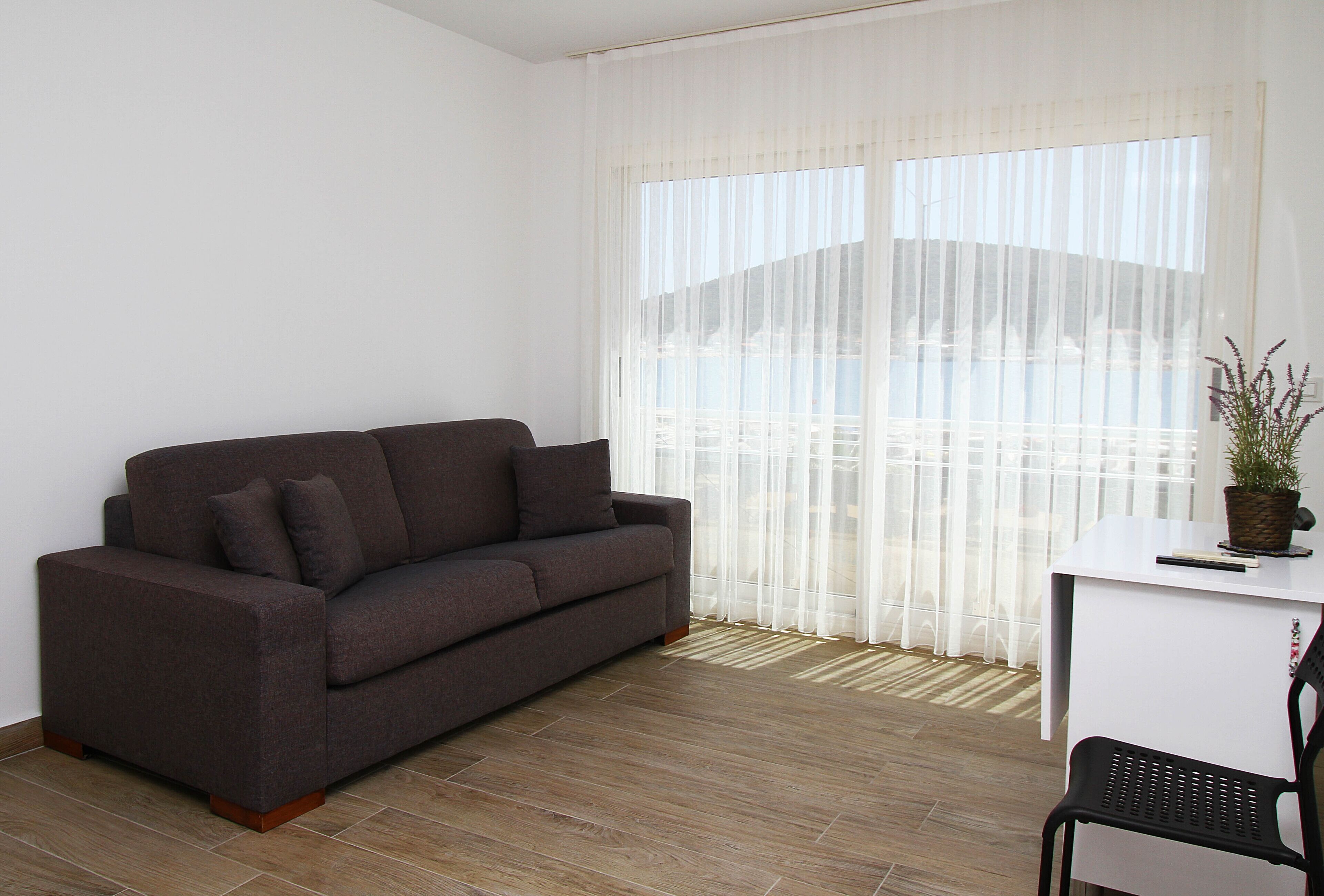 romantic apartment, 1 double bed with sofa bed, sea view | living area | 43-inch smart tv with satellite channels, tv
