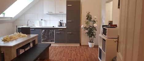 Full-sized fridge, microwave, stovetop, coffee/tea maker