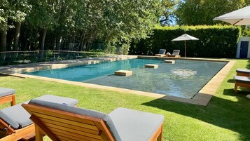 Outdoor pool, pool umbrellas, sun loungers