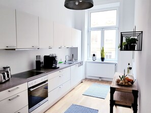Apartment, 4 Bedrooms, 2 Bathrooms | Private kitchen | Full-sized fridge, oven, stovetop, dishwasher