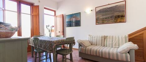 Apartment, 2 Bedrooms, Patio | Living area | Flat-screen TV