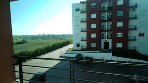 A multi-story building with a parking area in front. - Atlantic Ocean Residence 3044 (Asilah)
