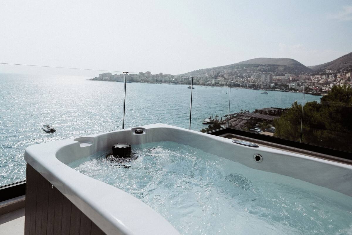 A hot tub with a city view.