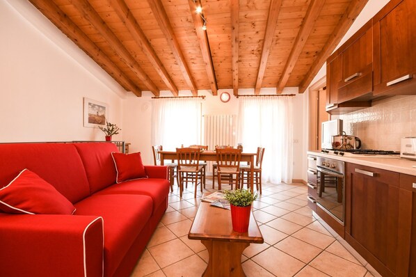 Apartment, 1 Bedroom | Living area | Flat-screen TV