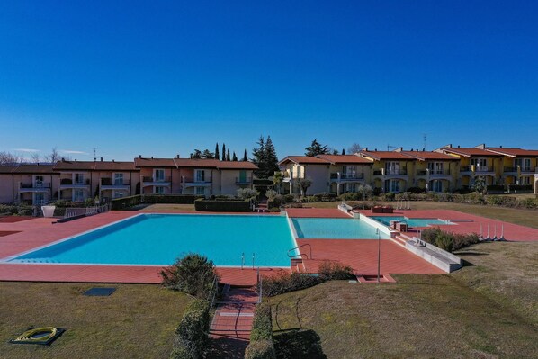 Seasonal outdoor pool, pool umbrellas, pool loungers