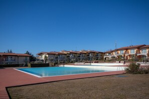 Seasonal outdoor pool, pool umbrellas, pool loungers