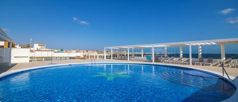 2 outdoor pools, pool umbrellas, pool loungers