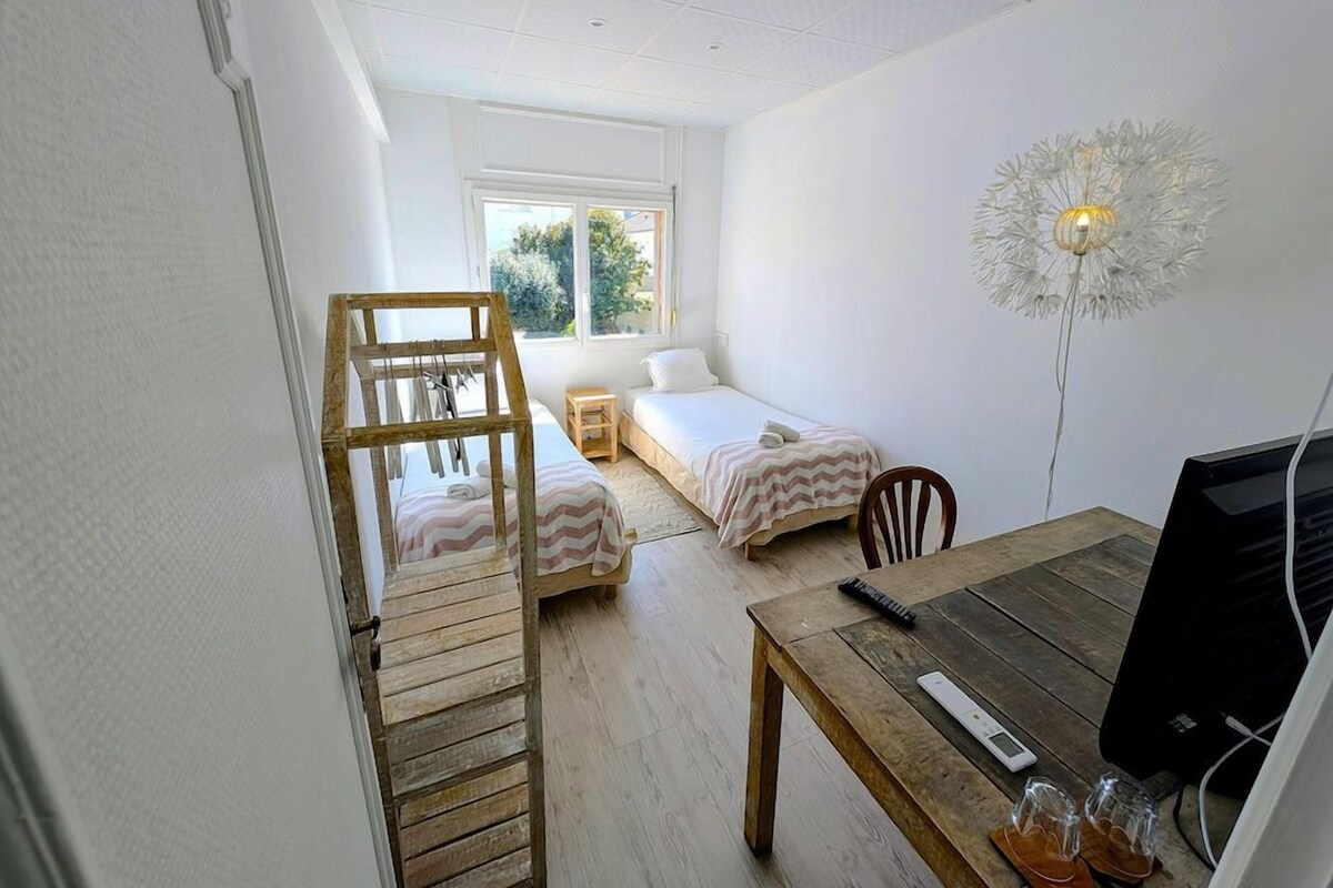 Premium bedding, desk, laptop workspace, blackout drapes