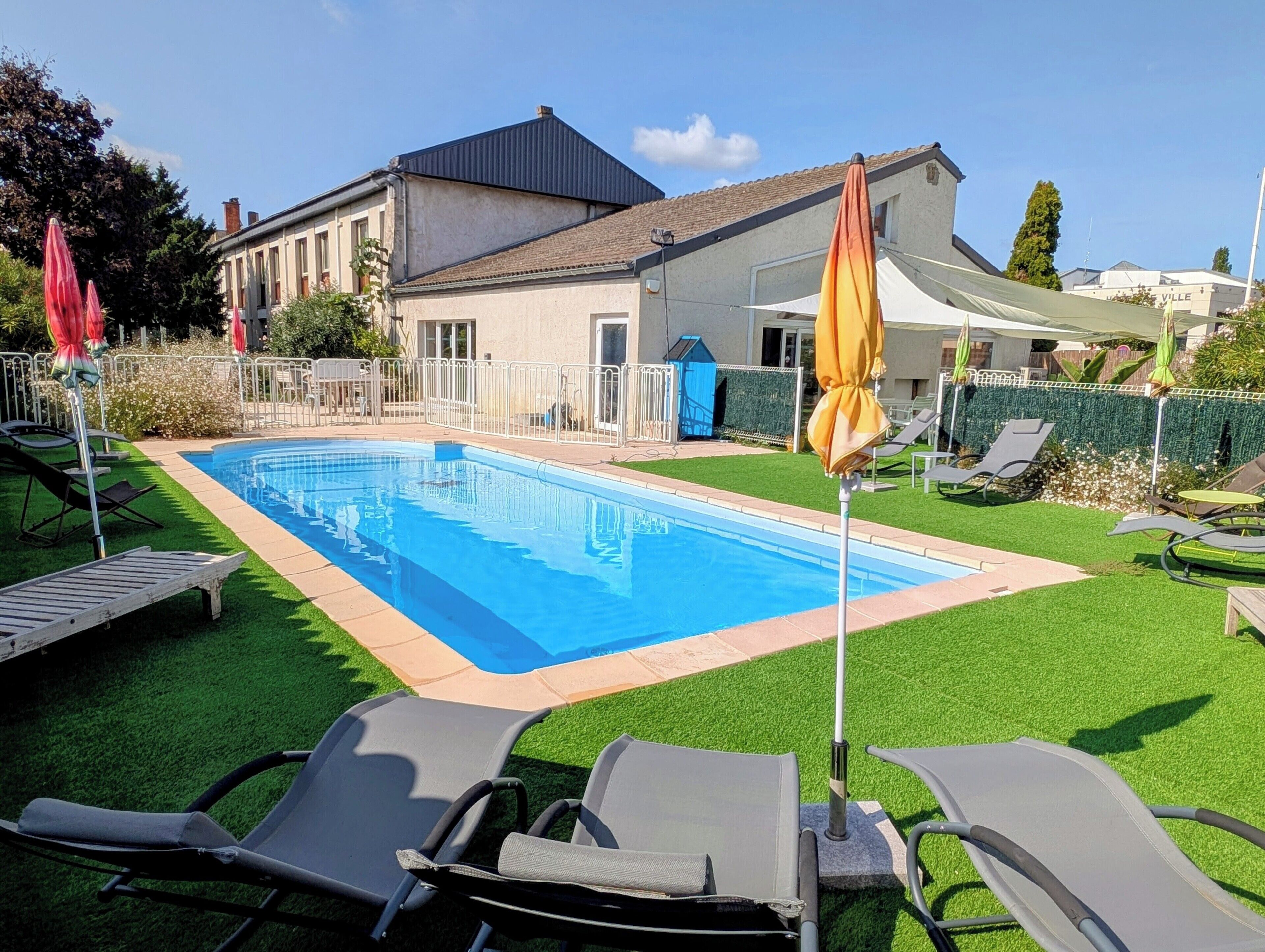 Seasonal outdoor pool, open 8:00 AM to 10:30 PM, pool umbrellas