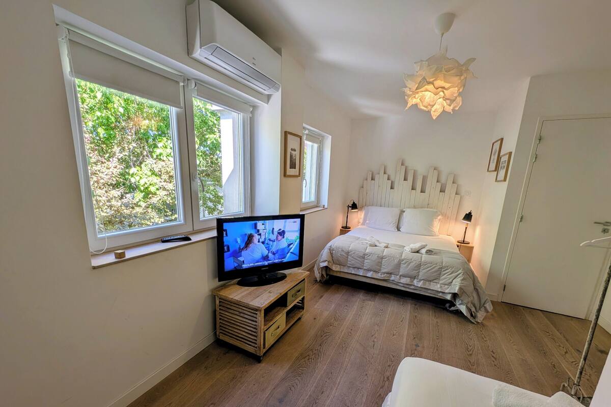 Premium bedding, desk, laptop workspace, blackout curtains