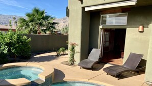 A swimming pool with lounge chairs, a patio area, and a mountain view. - Relaxing Desert Oasis-Salt Water Pool & Jacuzzi/Mountain Views/#067735 3bd (La Quinta)